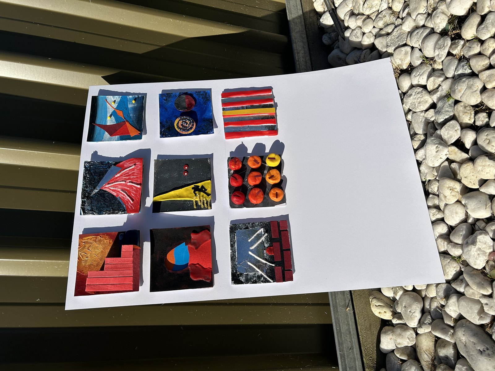 The tiles rearranged, photographed on stone steps.